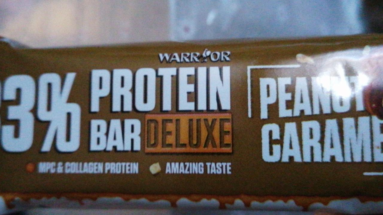 Fotografie - Warrior 33% protein bar deluxe Peanut caramel