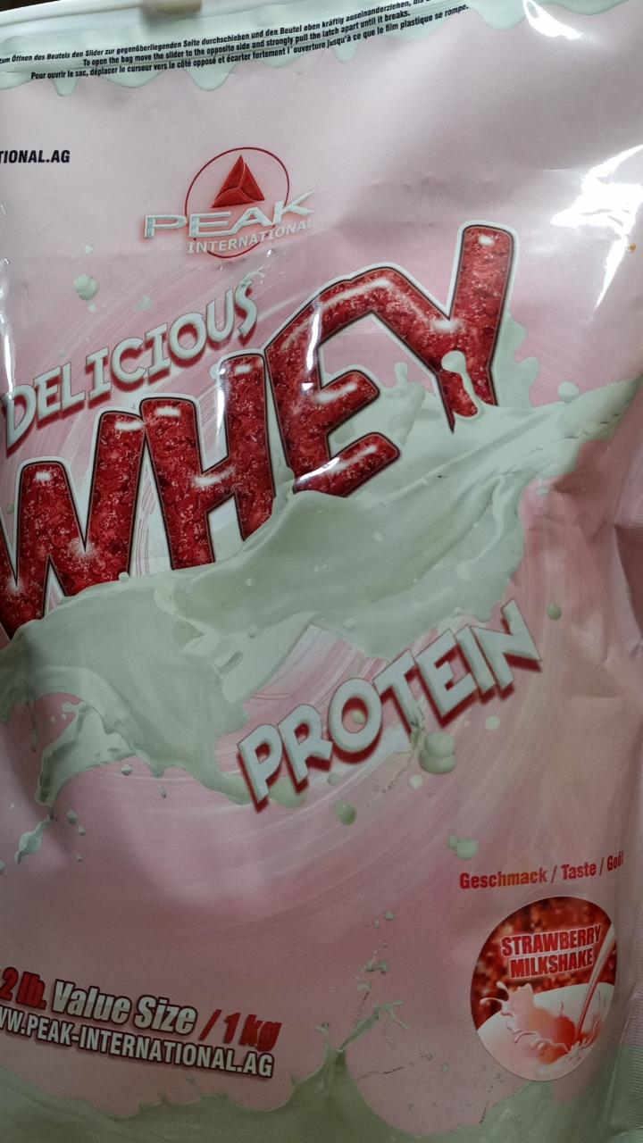 Fotografie - Delicious whey protein strawberry milkshake Peak