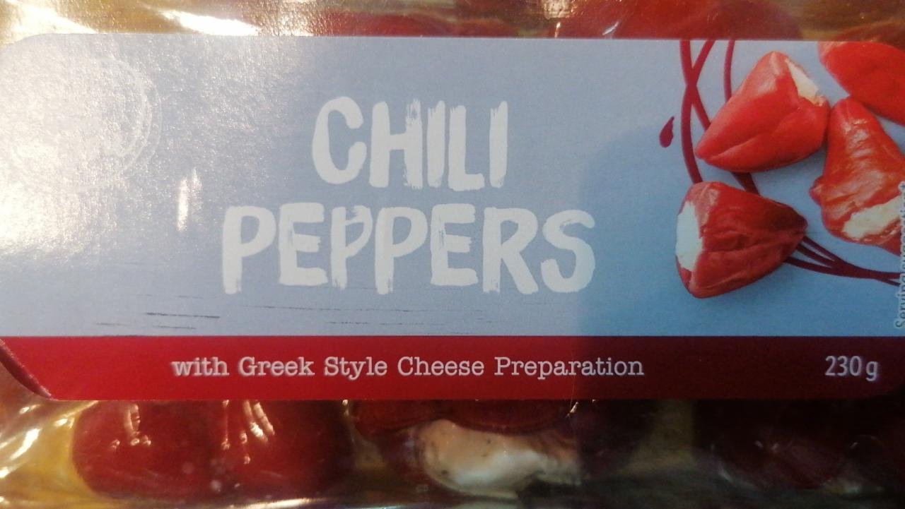 Fotografie - Chili Peppers with Greek style cheese preparation