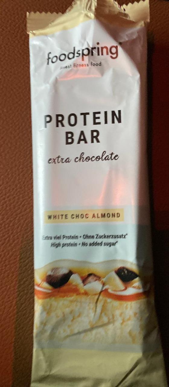 Fotografie - foodspring protein bar white choc almond