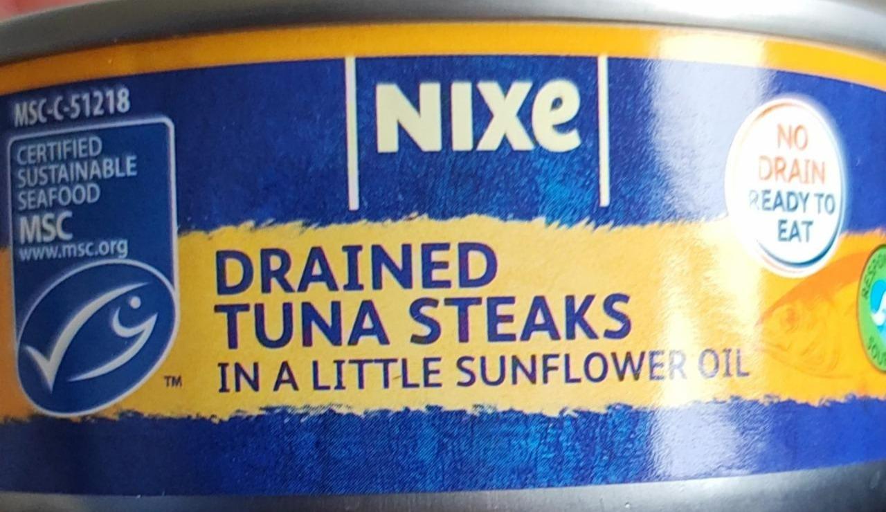 Fotografie - Drained tuna steaks in a little sunflower oil Nixe